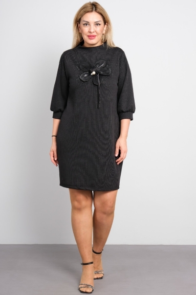 Plus size women's dress with floral detail on the front