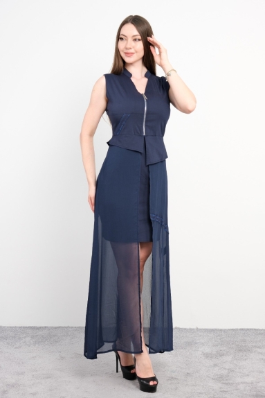  This dress has an elegant look, as shown in the front and back views. The front features a zippered design with an extra piece at the waist. It stands out with its asymmetrical cut and long sheer skirt. The dress is in dark navy blue color and has a long sheer fabric added over a mini skirt. The sleeves are designed sleeveless.