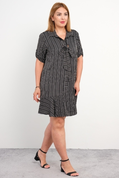  For plus size women, a knee-length elegant and stylish dress with line details, short sleeves, black color, and thin fabric.